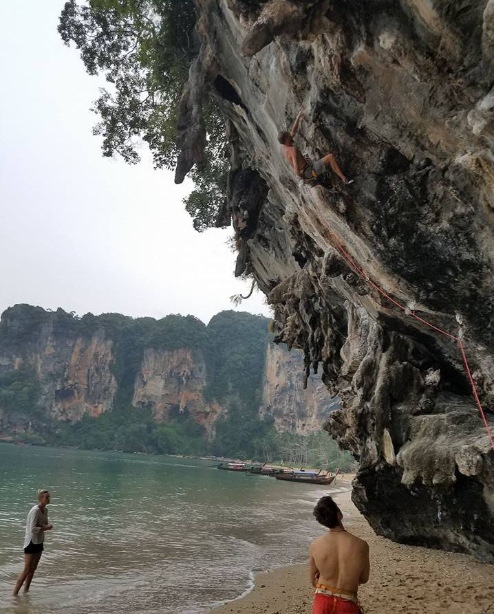 Climbing on limestone cliffs at Phra Nang near Krabi in Southern Thailand